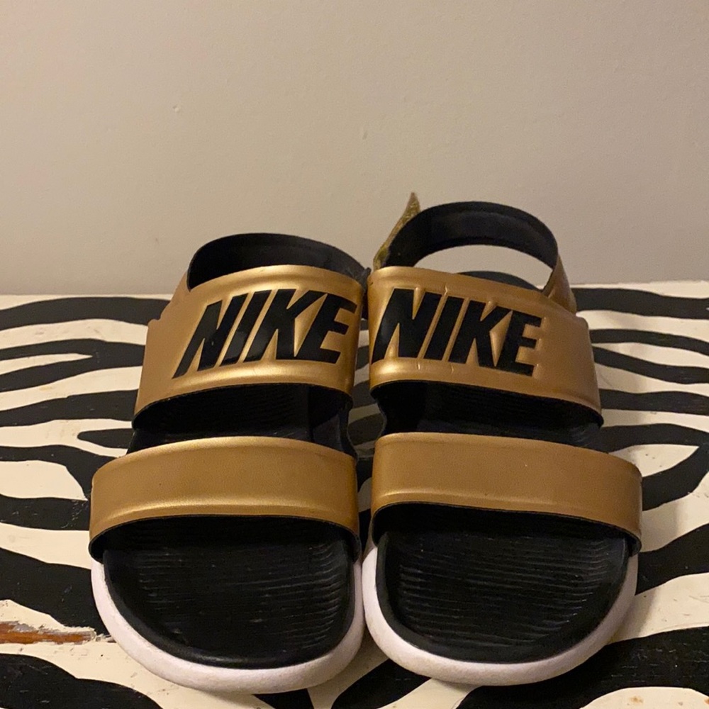Gold Nike sandals